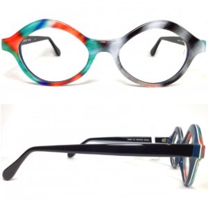 bernard shear- ophthalmic, plastic, oval, eyeglasses. multicolor, black, white, navy blue, teal, orange, indigo, with black temples. 