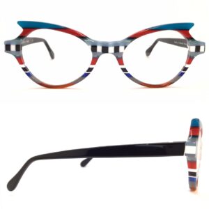 bernard shear- ophthalmic, plastic, oval-ish, eyeglasses. multicolor, teal, red, black, grey, white, clear orange, blue, grey stripes, with black temples 